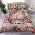 Flamingo quilt blanket styled in a bright bedroom with tropical flowers and romantic paired flamingo artwork