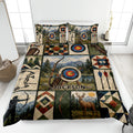 Archery quilt blanket on a bed with bows, arrows, targets, mountains, forests, and deer artwork
