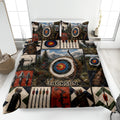 Archery quilt blanket displayed on a bed with colorful targets, bows, arrows, and mountain artwork