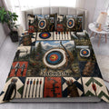 Archery quilt blanket styled in a bright bedroom with target, bow, arrows, and mountain scenes