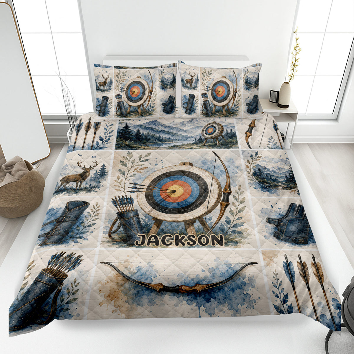 Archery quilt blanket displayed on a bed with bows, arrows, targets, mountain scenery, and deer artwork
