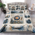 Archery quilt blanket styled in a bedroom with target, bow, arrow, quiver, deer, and mountain artwork