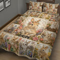 Close bedroom view of a floral bunny quilt blanket with rabbits in garden scenes