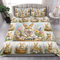 Rabbit quilt blanket styled on a bed with multiple floral bunny scenes and pastel Easter egg artwork