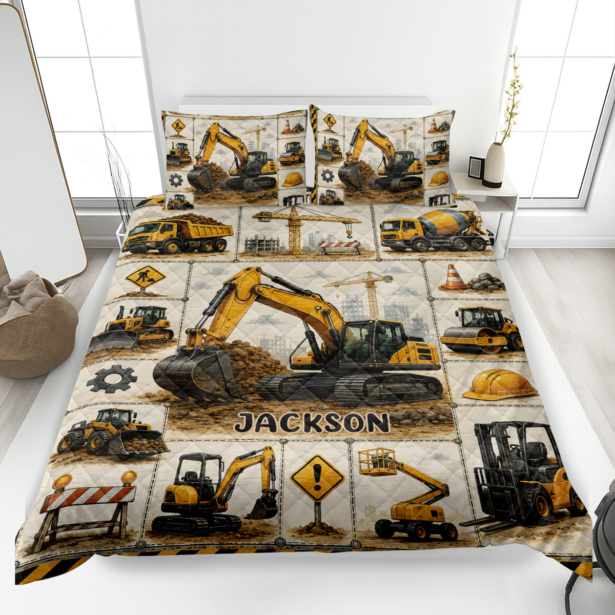 Excavator quilt blanket displayed on a bed with construction vehicles and custom-style artwork