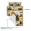 Close view of an excavator quilt showing the printed side and white quilted backing