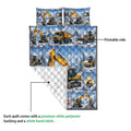 Excavator quilt blanket detail showing the printed construction scene and white quilted backing