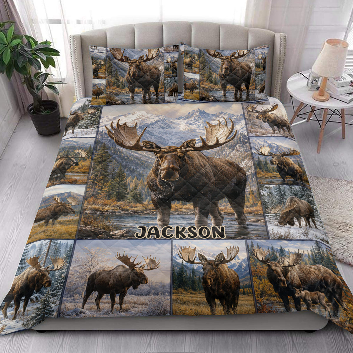 Moose quilt blanket styled in a bright bedroom with mountain and forest wildlife artwork
