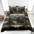 Moose quilt blanket styled on a bed with mountain, forest, lake, plaid, and rustic lodge artwork