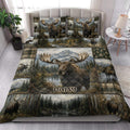 Moose quilt blanket presented in a bright bedroom with mountain, pine forest, and lake artwork