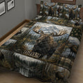 Close view of moose quilt bedding with mountain scenery, evergreen forest, lake, and plaid details