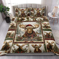 Christmas moose quilt blanket styled on a bedroom bed with festive woodland artwork