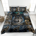 Wolf quilt bedding set displayed on a modern bed with forest, mountain, moon, and northern lights artwork