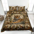 Tiger quilt bedding set displayed on a bed with a large tiger portrait and repeating jungle wildlife scenes
