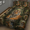 Tiger quilt spread across a bed with a large central tiger and surrounding forest scenes