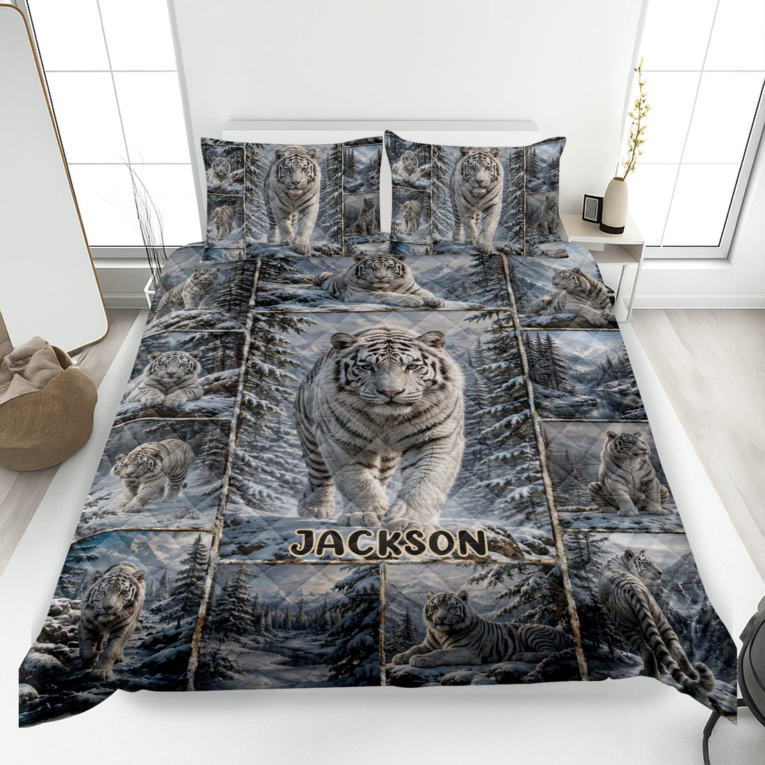 Tiger quilt blanket displayed on a bed with white tigers in a snowy forest scene