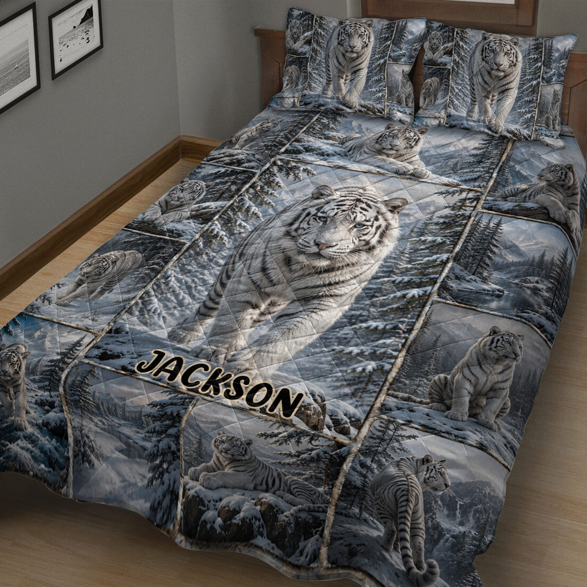 Close bedroom view of a tiger quilt blanket featuring white tigers and mountain forest scenery