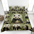 Panda quilt blanket displayed on a bed with bamboo forest artwork and multiple playful pandas