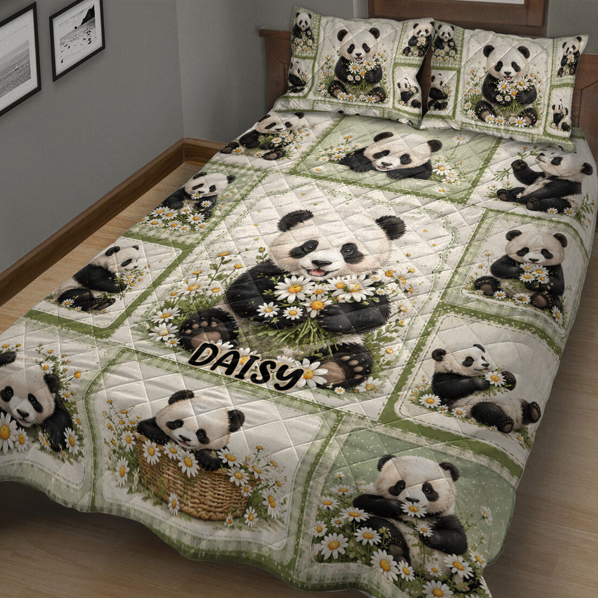 Close bedroom view of a panda quilt blanket featuring playful pandas, daisies, and soft green borders