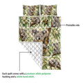 Koala quilt blanket detail showing the printed wildlife side and white diamond-quilted backing