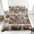 Koala quilt blanket displayed on a bed with Australian flowers and multiple koala portraits