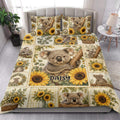 Koala and sunflower quilt blanket styled across a bright bedroom with coordinated bedding decor