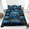 Shark quilt blanket bedding set displayed on a bed with underwater ocean scenes and colorful marine life