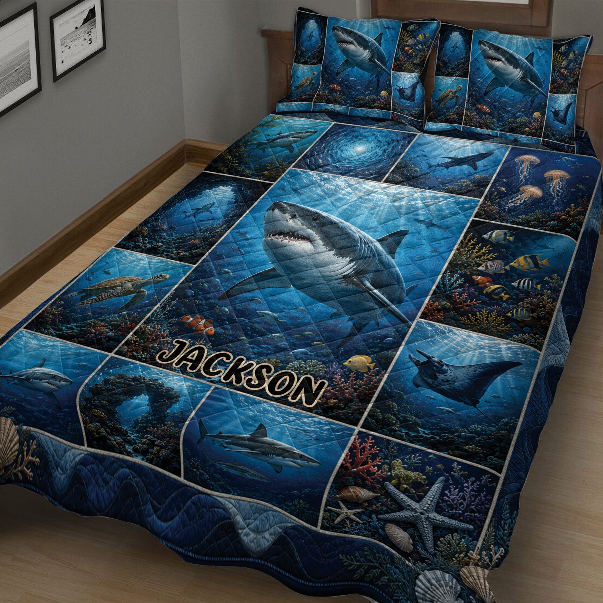 Close bedroom view of a shark quilt blanket with underwater panels, coral reefs, and marine life