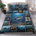Shark quilt bedding styled in a bright bedroom with coral reef, fish, turtle, and compass artwork