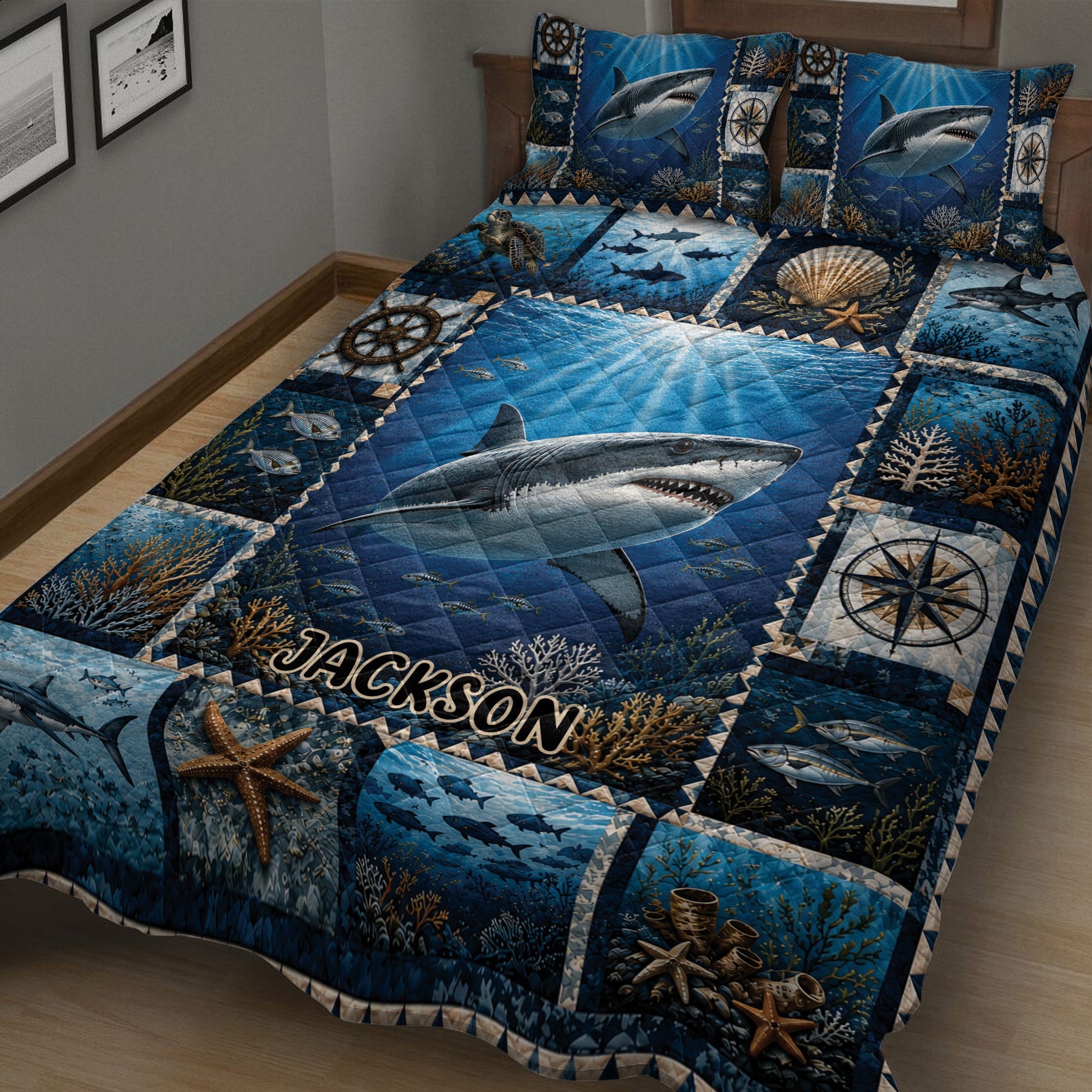 Close view of shark quilt bedding with deep blue ocean artwork, coral, fish, and nautical details