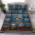 Christmas shark quilt blanket styled on a bed with colorful underwater holiday artwork