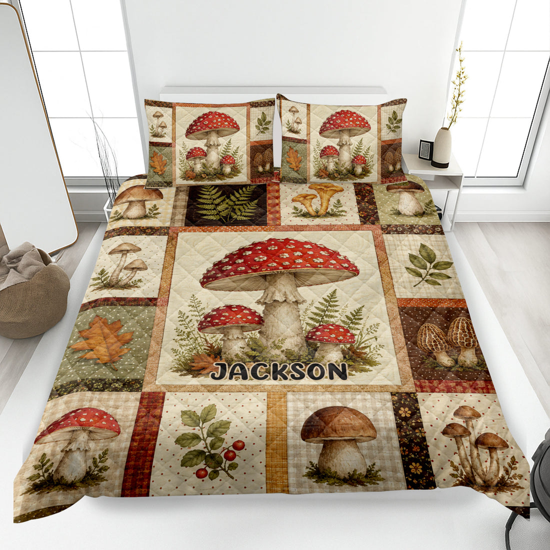 Mushroom quilt blanket displayed on a bed with forest fungi, ferns, leaves, and rustic woodland artwork