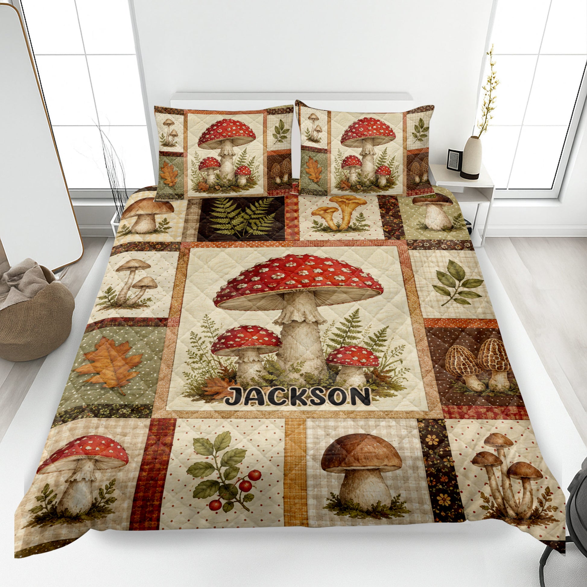 Mushroom quilt blanket displayed on a bed with forest fungi, ferns, leaves, and rustic woodland artwork
