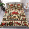 Christmas mushroom quilt blanket styled on a bed with red toadstools, pine branches, ornaments, and poinsettias