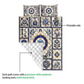 Evil Eye quilt showing its printed front and white diamond-quilted backing