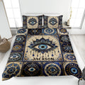 Evil Eye quilt blanket spread across a modern bed with ornate blue, gold, and cream eye motifs