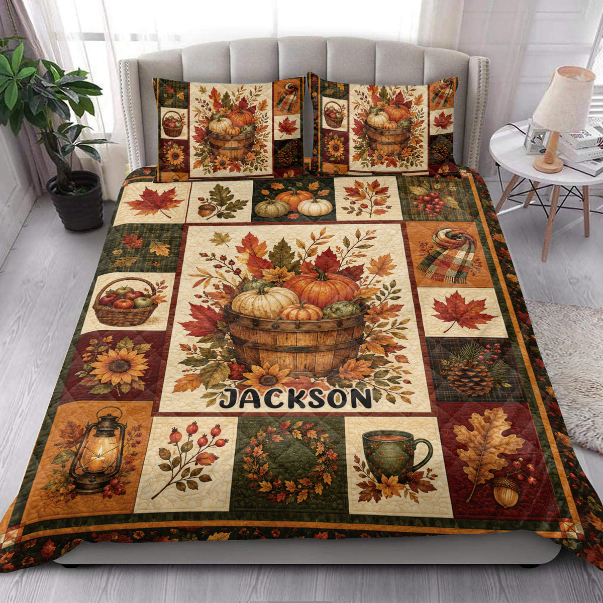 Autumn pumpkin and fall leaf quilt blanket styled in a bright bedroom with matching seasonal artwork