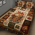 Close view of autumn quilt bedding with pumpkins, maple leaves, sunflowers, berries, and rustic harvest motifs