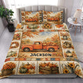 Autumn quilt blanket styled on a bedroom bed with orange pickup truck, pumpkins, sunflowers, and maple leaves
