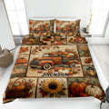 Thanksgiving quilt blanket featuring a vintage pickup truck, pumpkins, autumn leaves, sunflowers, and harvest scenes on a bed