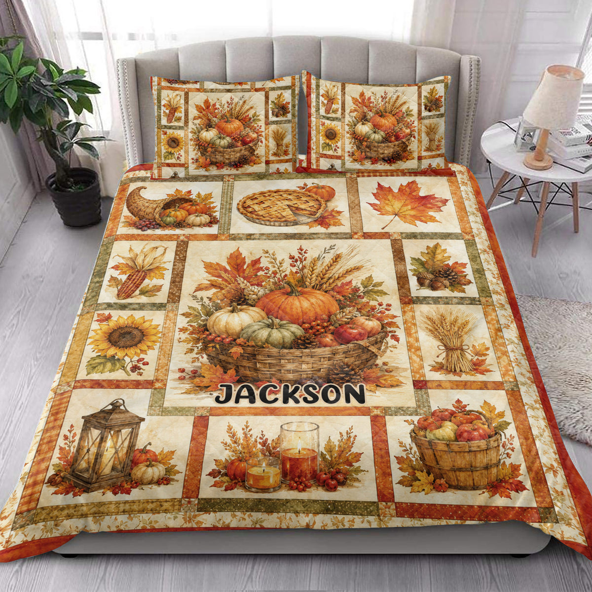 Thanksgiving harvest quilt blanket styled on a bedroom bed with pumpkins, sunflowers, leaves, and autumn decor