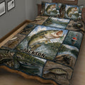 Close view of fishing quilt bedding with bass, tackle, fishing reels, a boat, lake scenery, and rustic artwork