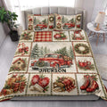 Christmas quilt bedding styled on a bed with vintage red trucks, snowy forests, wreaths, and festive red accents
