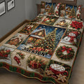Close bedroom view of a Christmas quilt blanket featuring winter cabins, ornaments, gifts, poinsettias, and snowmen