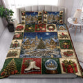 Christmas quilt blanket styled in a bedroom with snowy village, poinsettias, wreaths, gifts, and festive holiday scenes