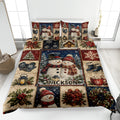 Christmas quilt blanket displayed on a bed with snowmen, snowflakes, wreaths, trees, gifts, and winter decor