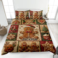Christmas gingerbread cookie quilt blanket displayed on a bed with festive red, green, and beige artwork
