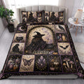 Witchcraft quilt blanket styled in a bright bedroom with witch, black cat, raven, candle, and purple botanical artwork