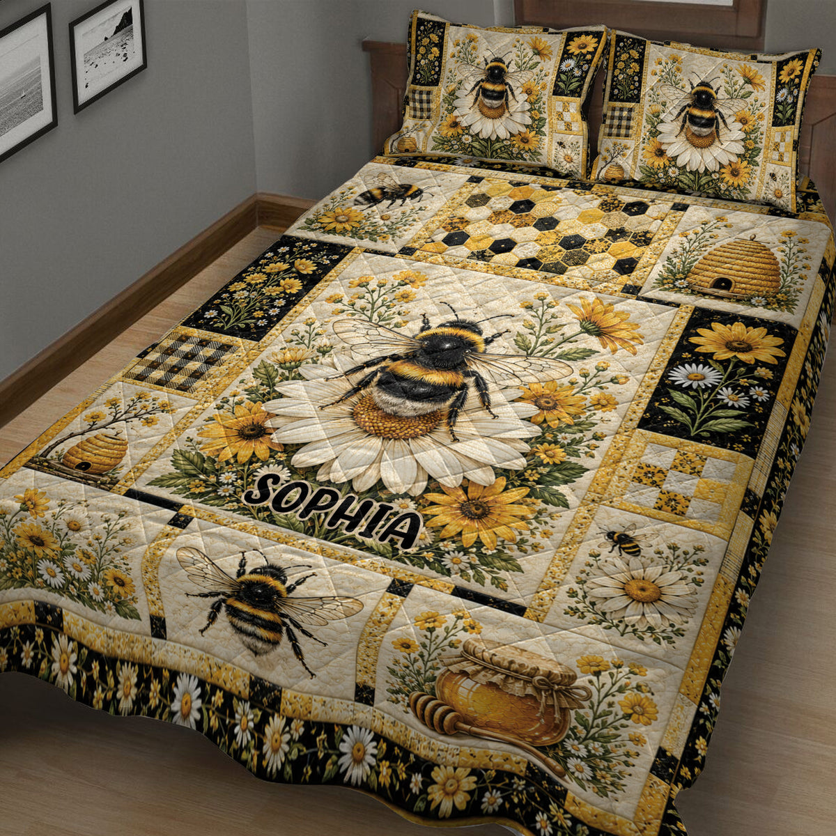 Close bedroom view of a bee quilt blanket with daisies, honeybees, honeycomb patterns, and golden floral accents