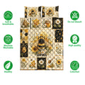 Bee quilt bedding set shown flat with honeycomb panels, sunflowers, daisies, and beehive artwork